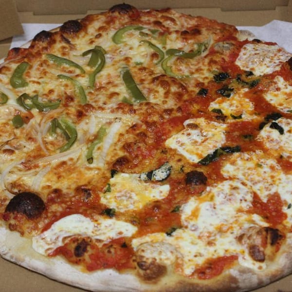 Half green pepper and onion pizza, half Margherita pizza with fresh mozzarella and basil.