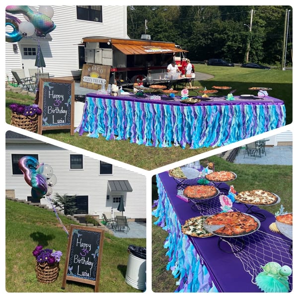 Marco Pizzeria's food truck and a mermaid-themed table with various pizzas for a birthday party.