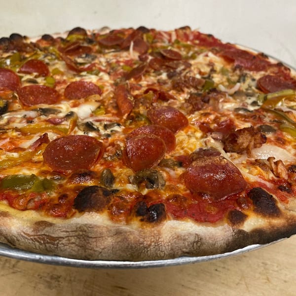 Marco Pizzeria's large, hot Italian pizza with pepperoni, sausage, peppers, onions, and mushrooms.